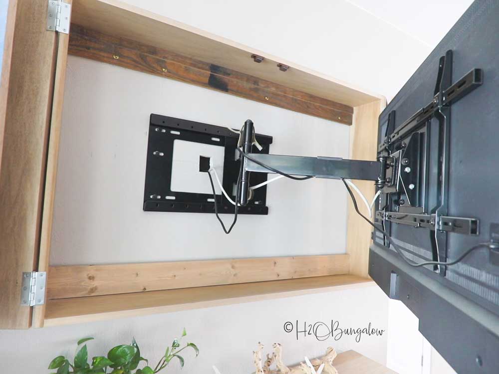 wall mounted tv on swing out arm mount showing back of tv