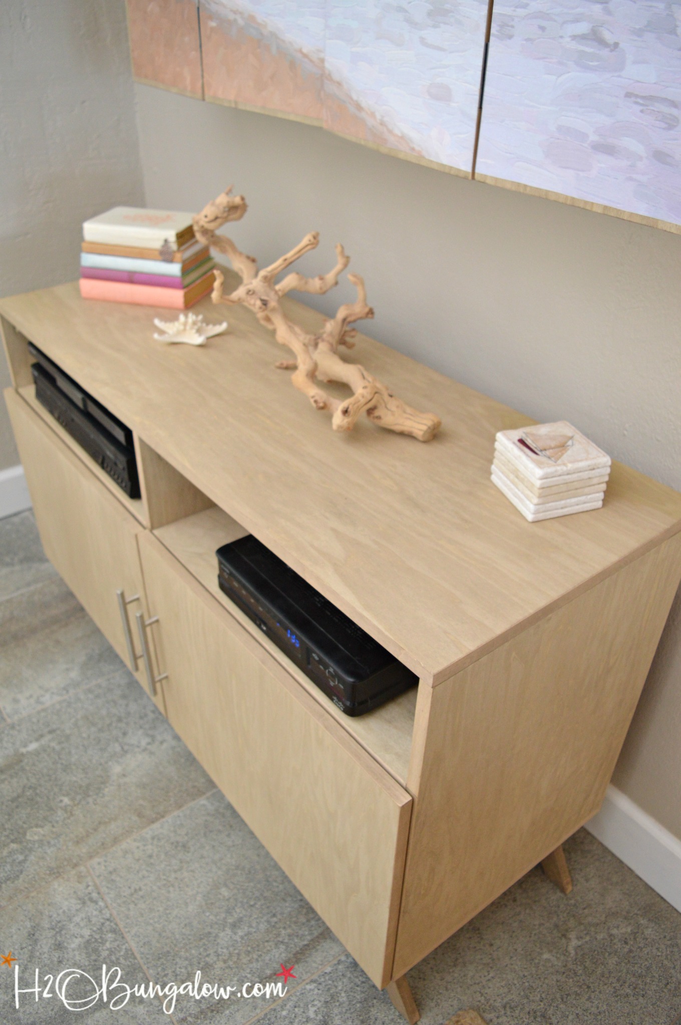 DIY media console with free plans tutorial. Build a media cabinet to hold electronics, add the matching wall mounted TV cabinet for under $150! Looks great in small spaces! 