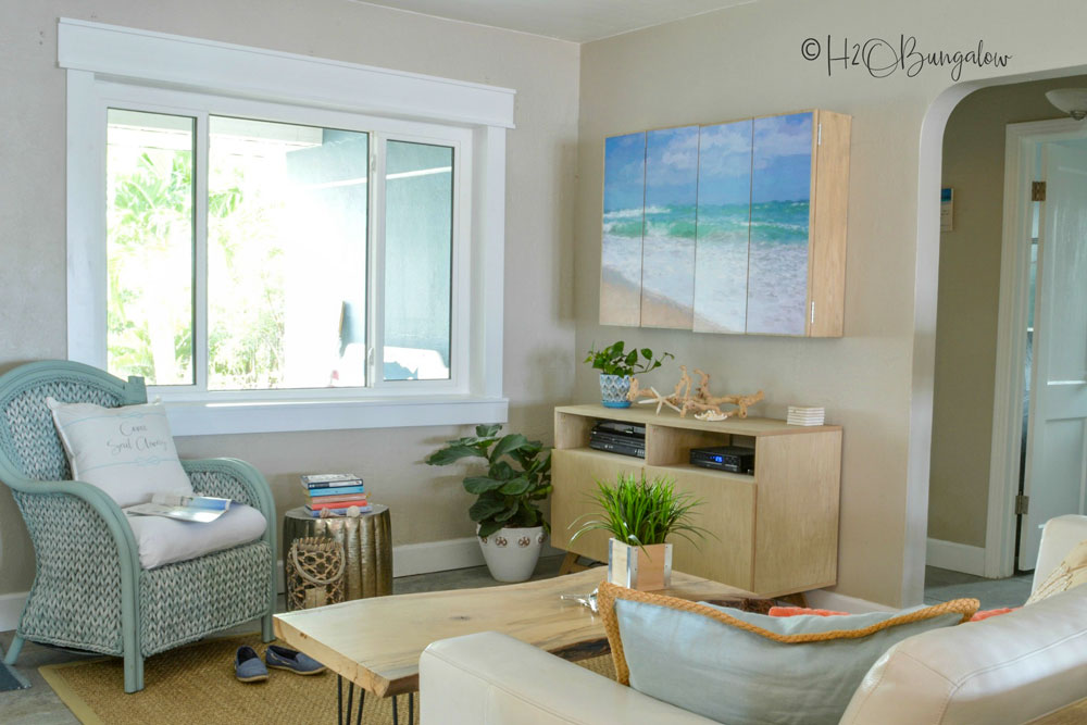 living room with rattan painted chair 