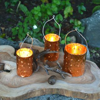 DIY copper tin can candle holders are a simple upcycle project for outdoor lighting. Make your own candle holders from cans and a drill.