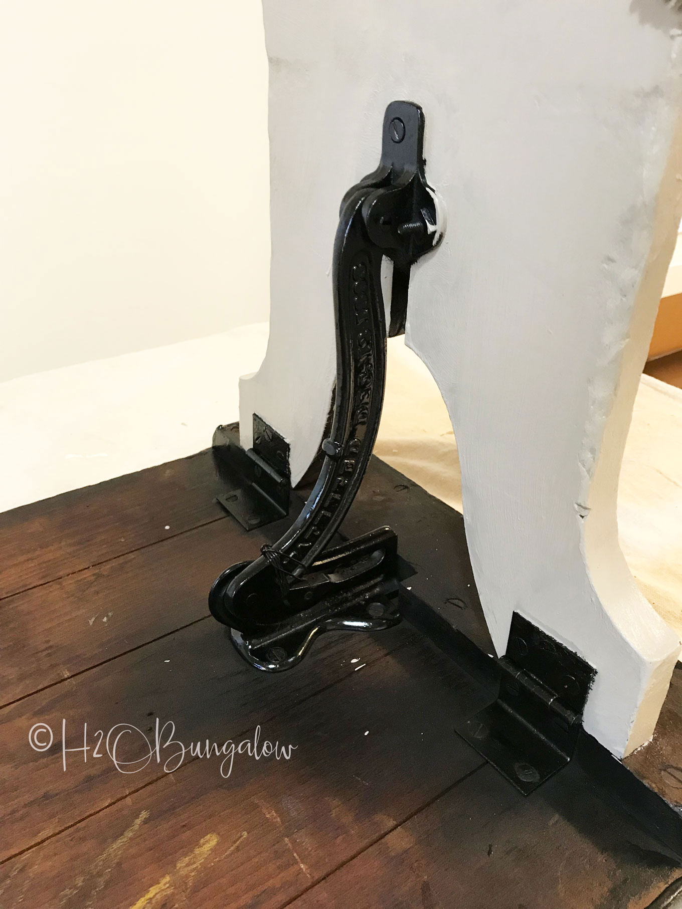Vintage folding bench makeover turned a wood and metal hardware bench into a stylish bedside table. Furniture painting makeover tutorial. 