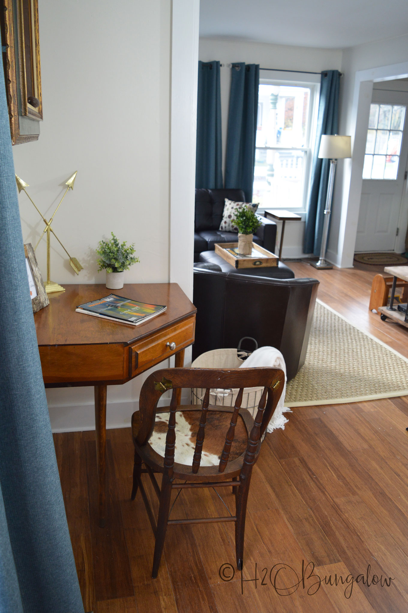 Tutorial for a cowhide chair makeover using real cowhide for the chair seat. Make this a fabulous accent chair with faux animal print or a cowhide. 