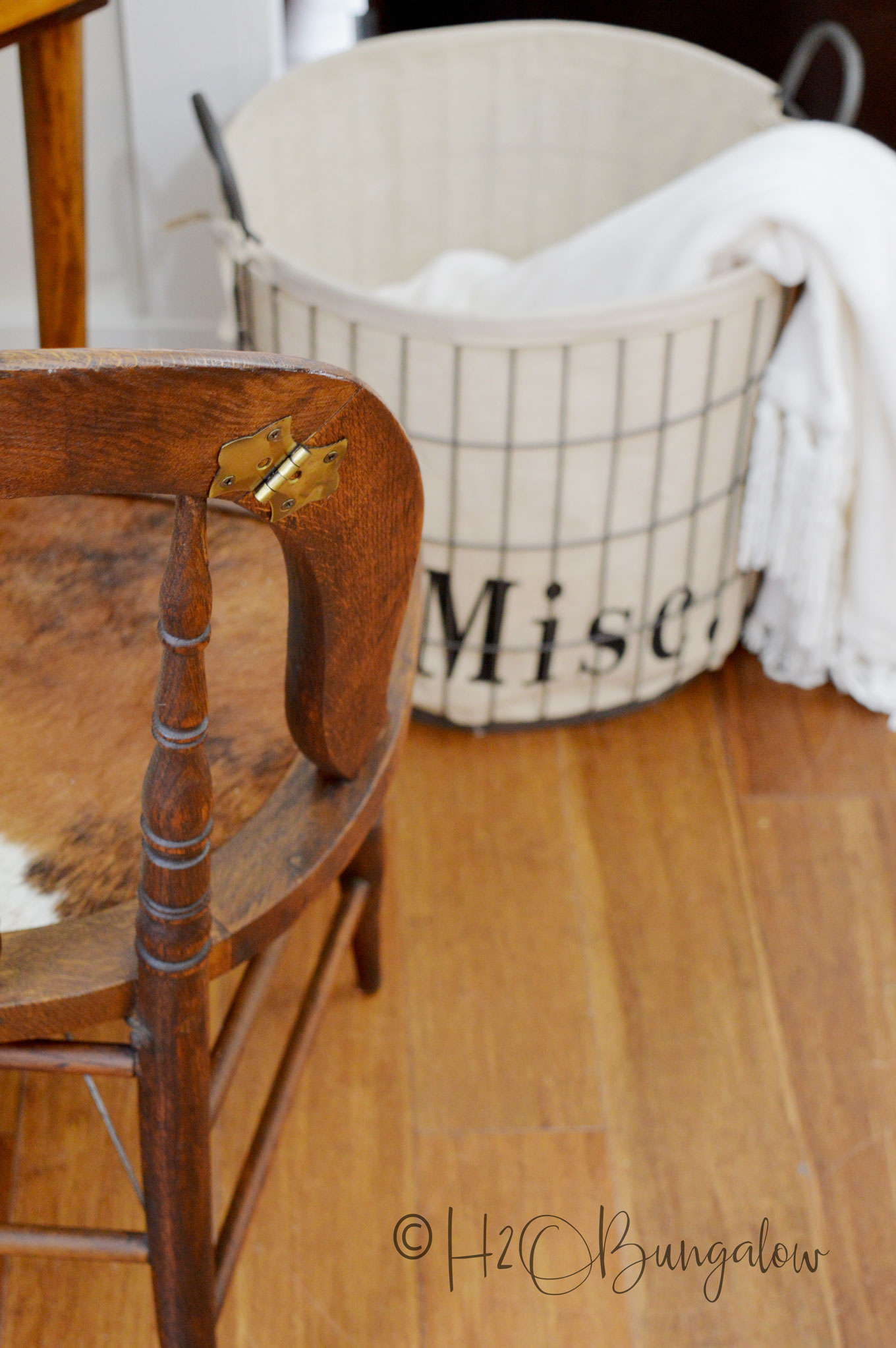 Tutorial for a cowhide chair makeover using real cowhide for the chair seat. Make this a fabulous accent chair with faux animal print or a cowhide. 