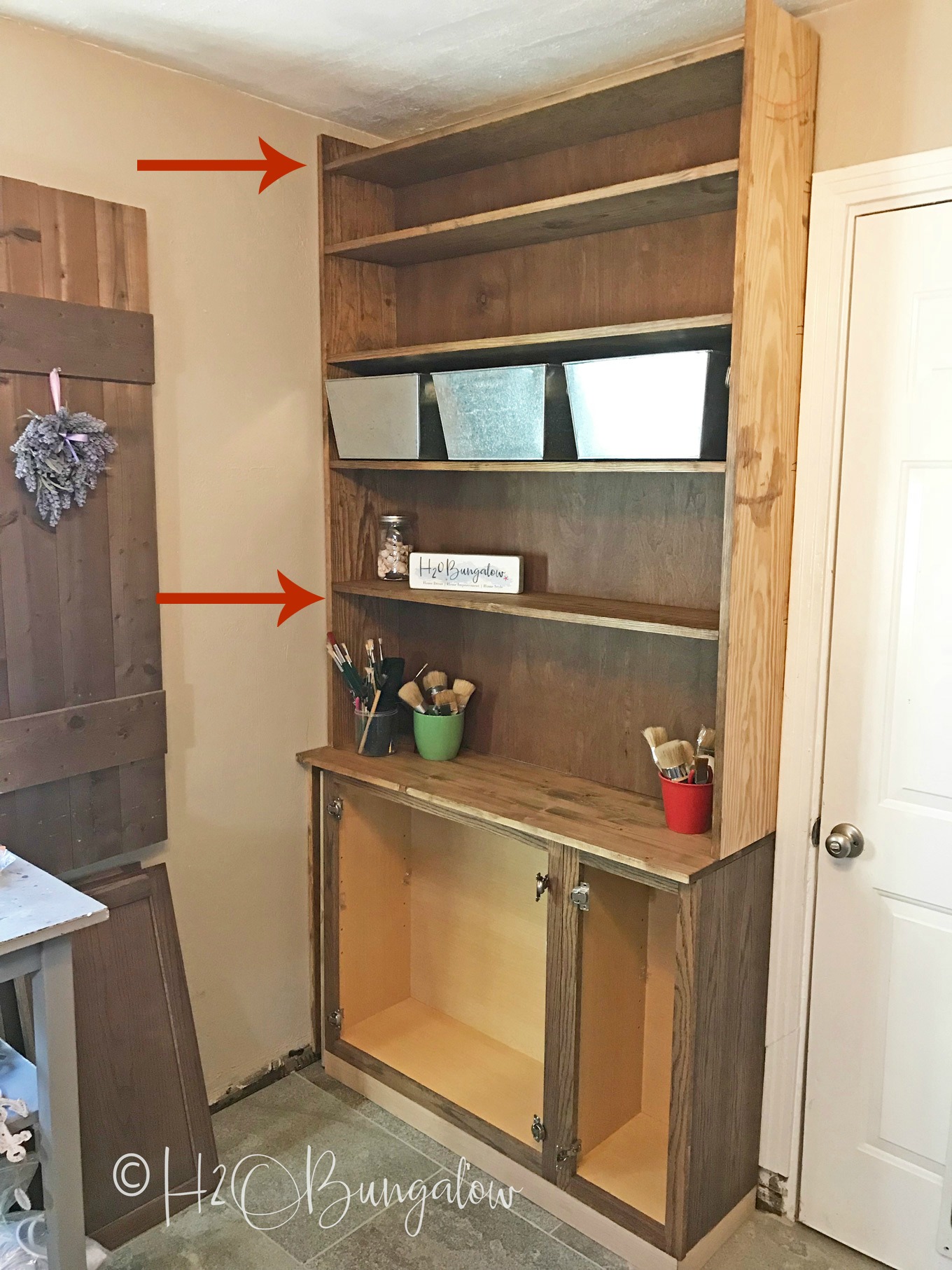 How to build built in bookcases with cabinets is a detailed DIY tutorial with lots of pictures and step by step instructions.  If you want storage and to make custom DIY book cases or want to know how to make built in bookshelves with wall cabinets, this is the tutorial for you. My built ins cost me under $400 to make! 