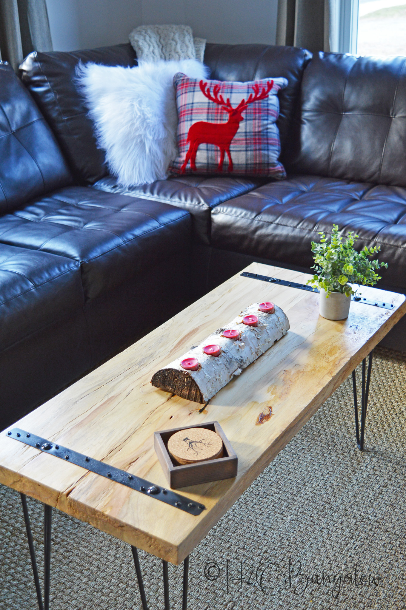 I'm loving the simplicity of this DIY rustic coffee table. I used two wide planks for the table top, but you could easily make a coffee table, or end tables with several wood boards or planks. Modify these DIY plans a little and it's an easy build requiring few tools and not a lot of time. 