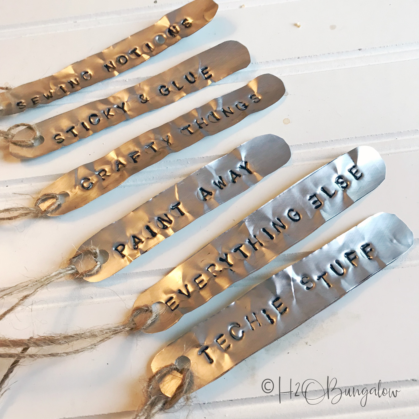 Easy to make soda can stamped metal labels for galvanized bins is a perfect farmhouse or rustic modern style home decor. Try stamping metal labels for home and office organization. One can makes several labels. Make other crafts with metal stamping and soda can metal too. 
