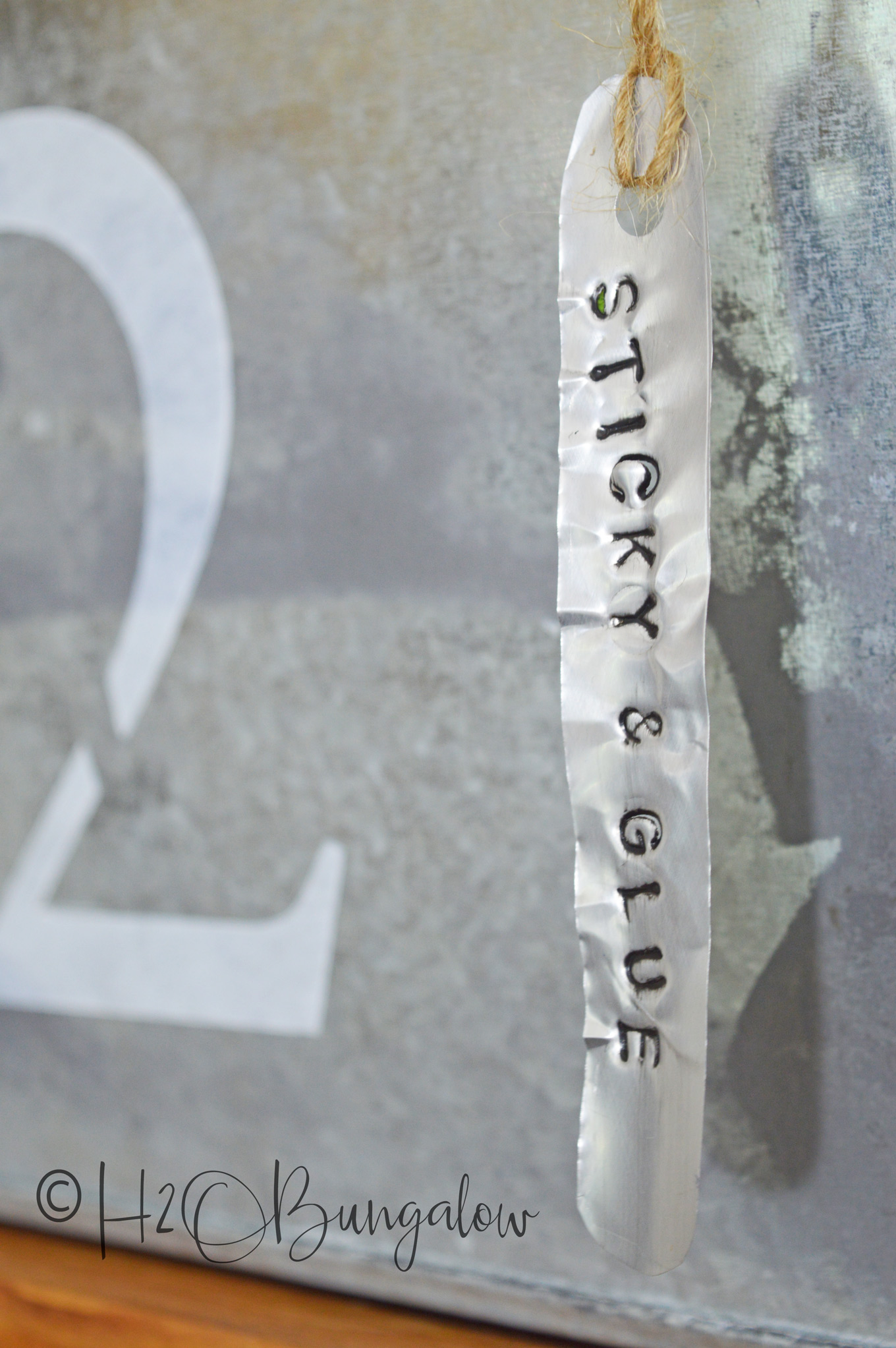 Easy to make soda can stamped metal labels for galvanized bins is a perfect farmhouse or rustic modern style home decor. Try stamping metal labels for home and office organization. One can makes several labels. Make other crafts with metal stamping and soda can metal too. 