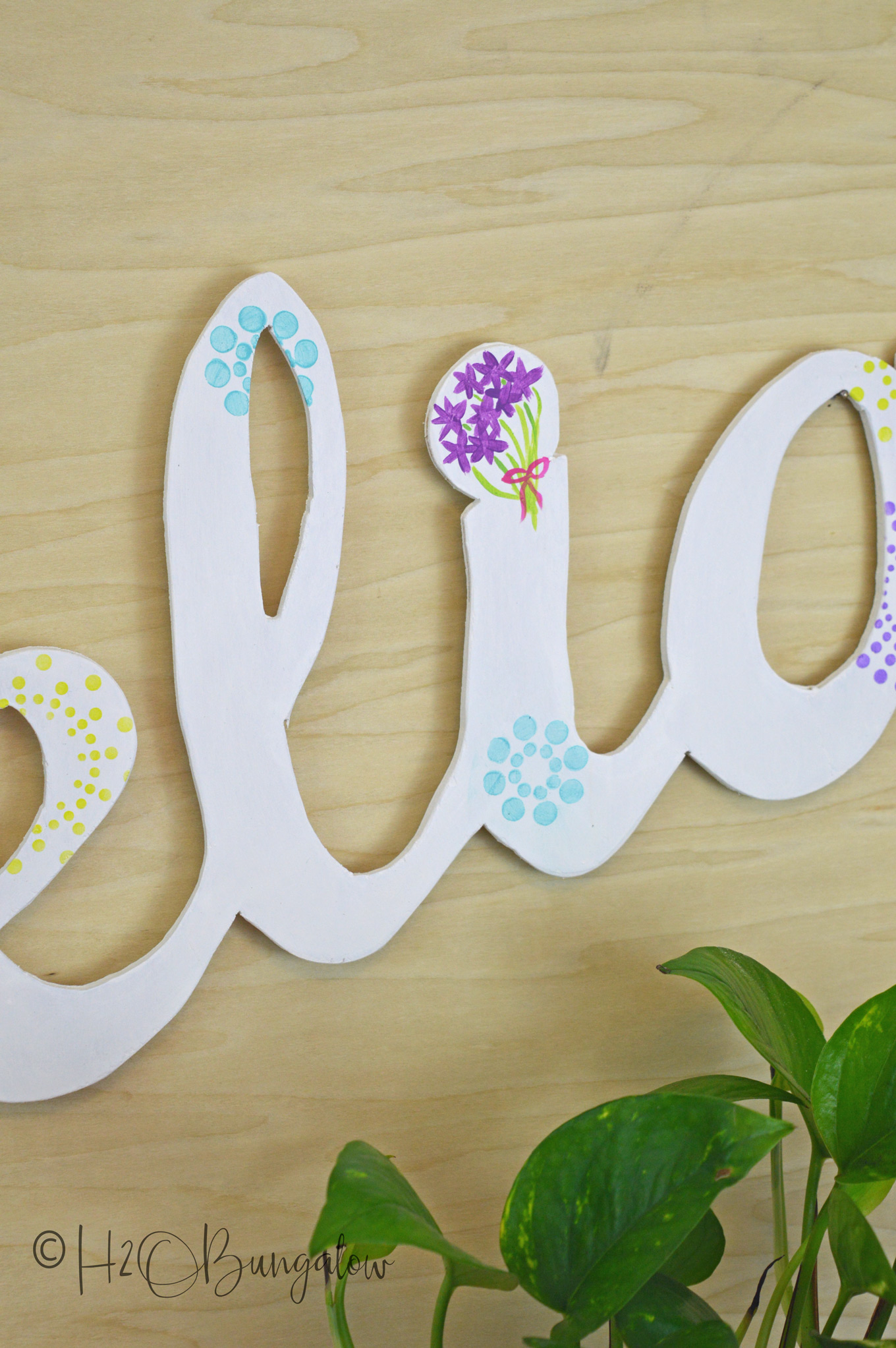 Tutorial to make a DIY large wood name cut out. Easy project to make using a 1/4" piece of scrap plywood, a jigsaw and a palm sander.  I've cut large script letters out of wood before and have a good tutorial which I link to below.  This post shares more tips for making clean cuts when cutting out words with a jigsaw.