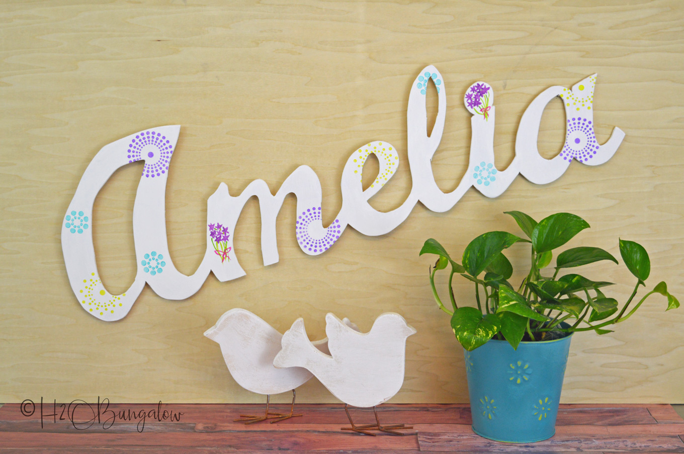 Tutorial to make a DIY large wood name cut out. Easy project to make using a 1/4" piece of scrap plywood, a jigsaw and a palm sander.  I've cut large script letters out of wood before and have a good tutorial which I link to below.  This post shares more tips for making clean cuts when cutting out words with a jigsaw.