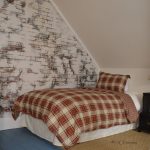German schmear wall treatment on wall in loft bedroom