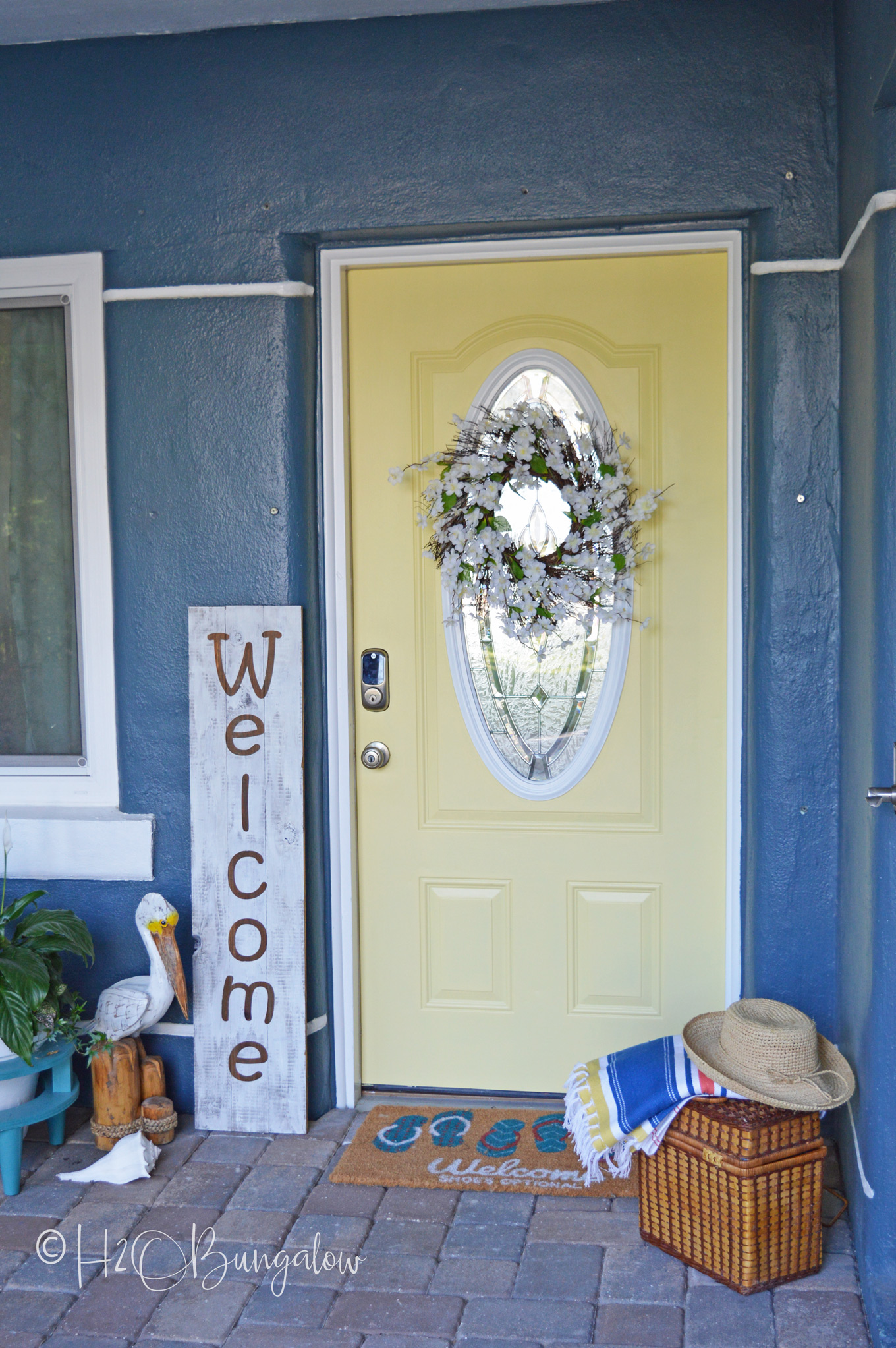 I can't believe I finally bit the bullet and changed out the entry to a yellow painted front door, Guys!  Thinking about painting your front door yellow or maybe even another color? See my tutorial on how to paint a front door, pick out a color and links to my most popular home improvement painting tutorials