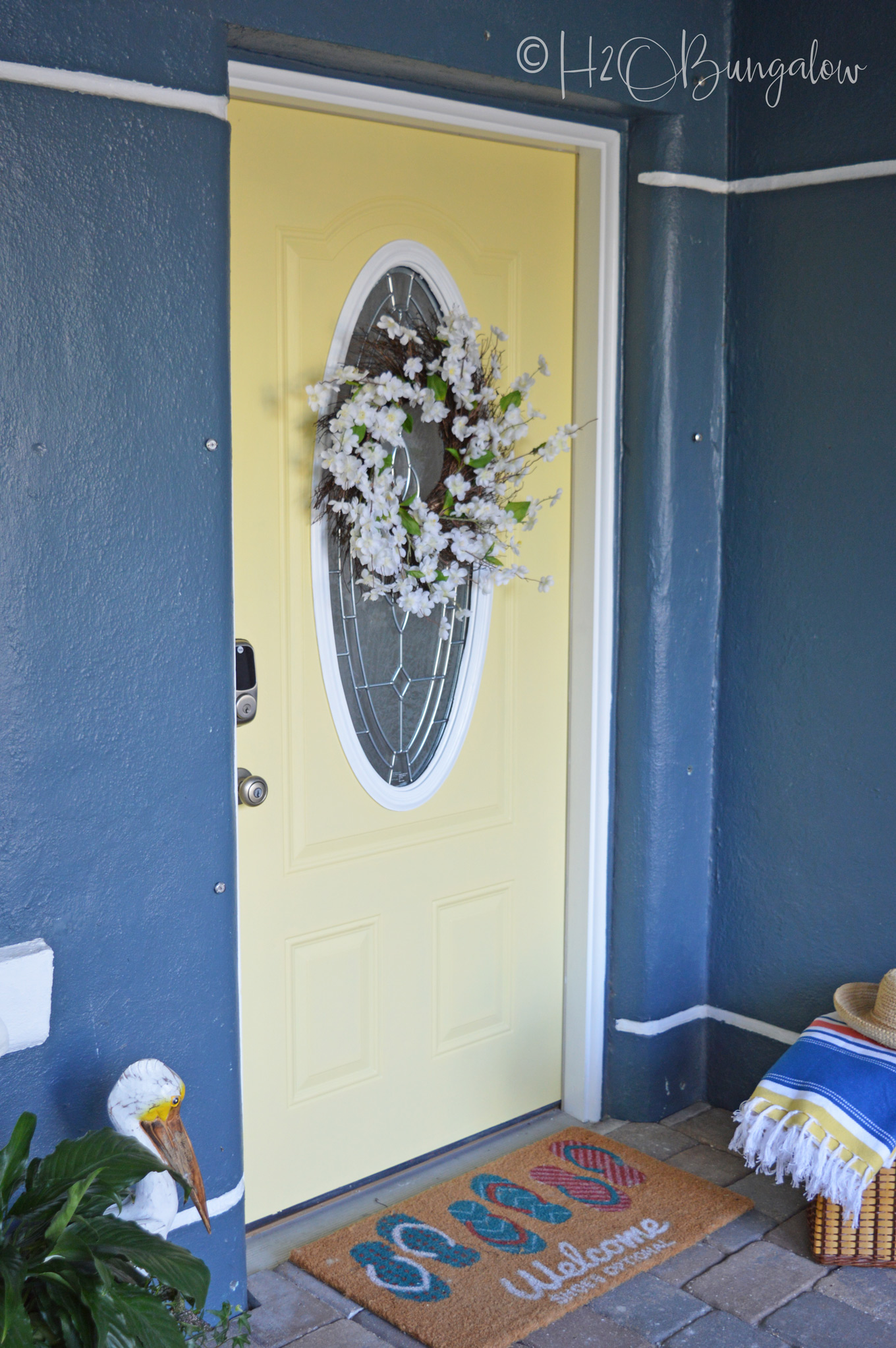 I can't believe I finally bit the bullet and changed out the entry to a yellow painted front door, Guys!  Thinking about painting your front door yellow or maybe even another color? See my tutorial on how to paint a front door, pick out a color and links to my most popular home improvement painting tutorials