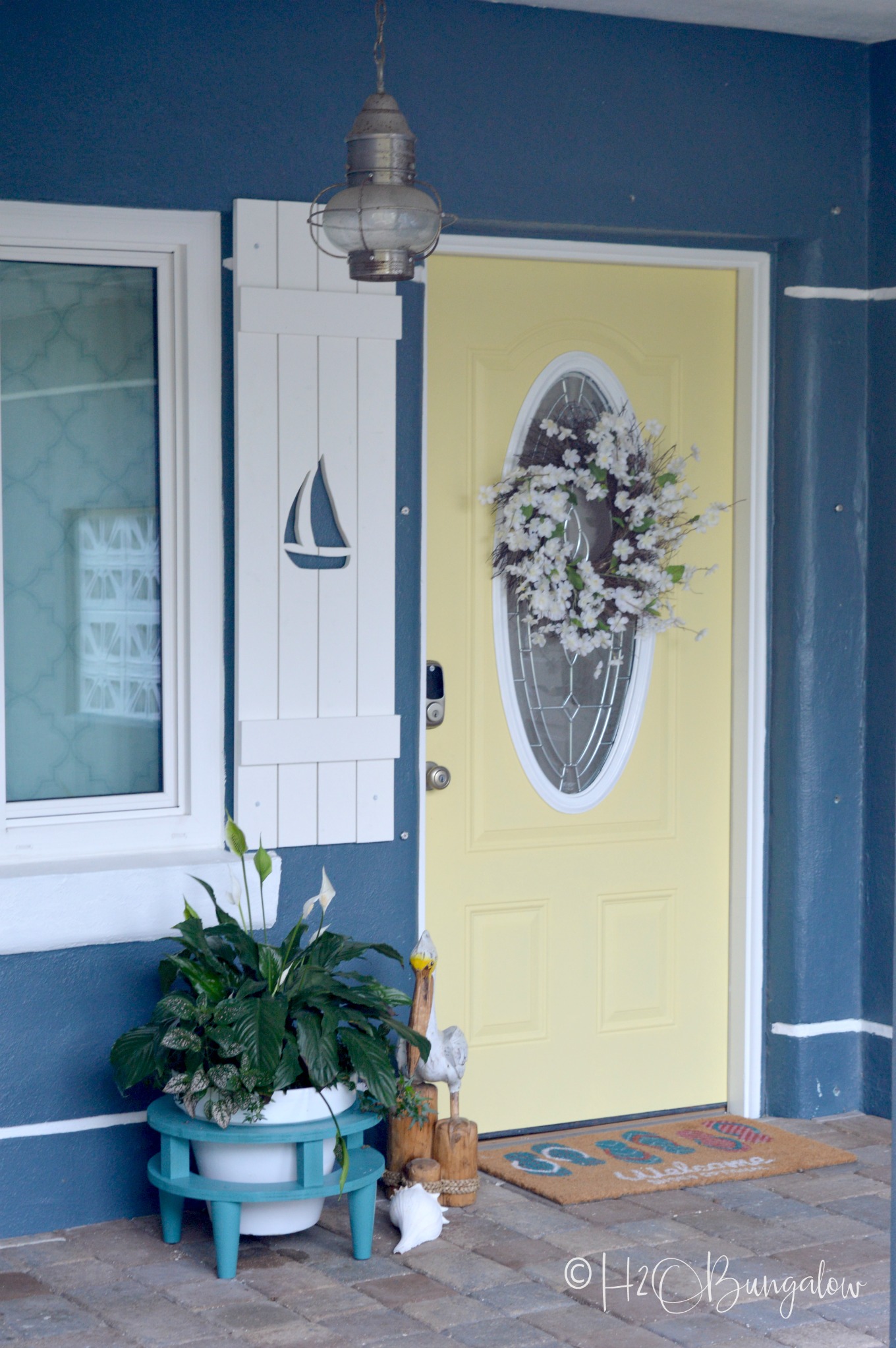 Video and tutorial on how to make exterior DIY shutters with sailboat cutouts from long lasting pvc. Download my free sailboat cutout pattern or see my tips to make your own decorative shutter cutouts. Exterior decorative shutters with designs cut out add charm and curb appeal and are easy to make! 