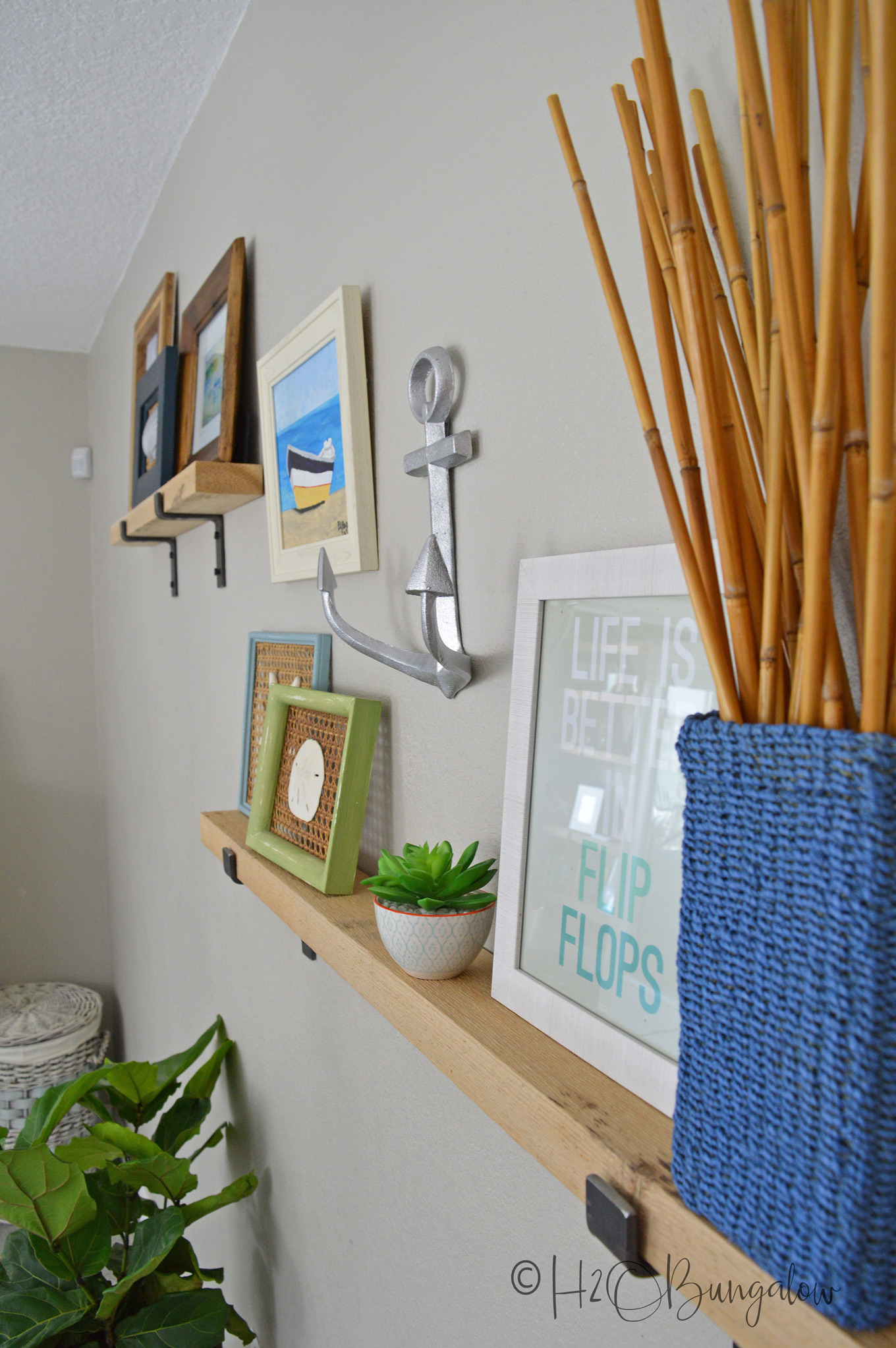  Learn how to style picture ledges in a gallery wall. Use my six steps and tips to create a beautiful themed gallery wall with a mixture of art and other items to add interest. A wall vignette is a fantastic decorating idea and solution for a large blank wall in a room. 