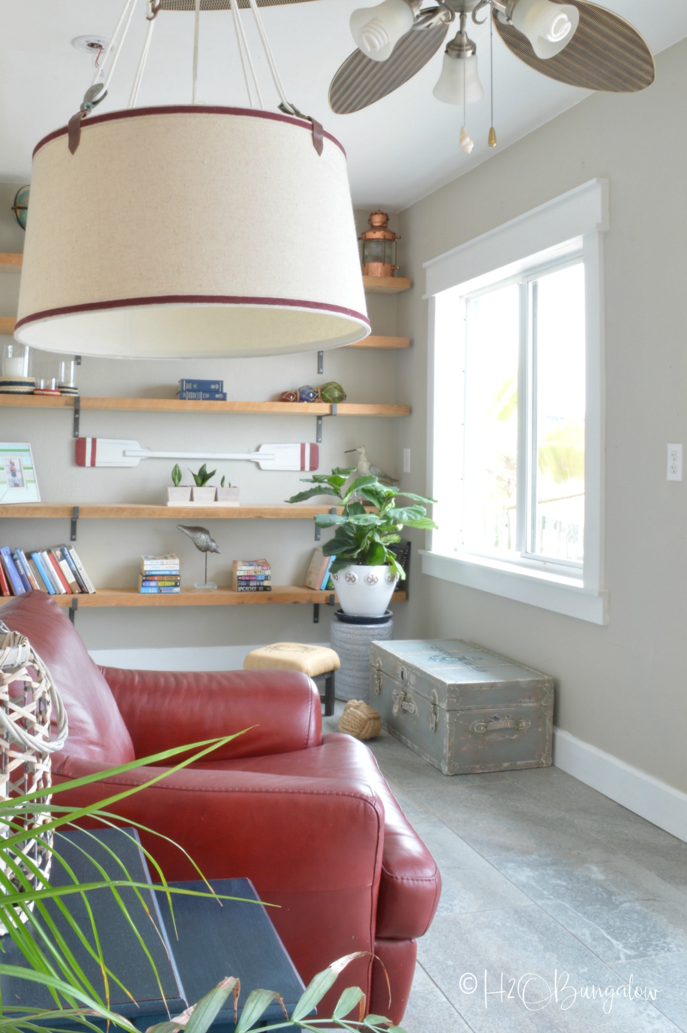 DIY baseboard shown in living room with DIY craftsman style window trim 
