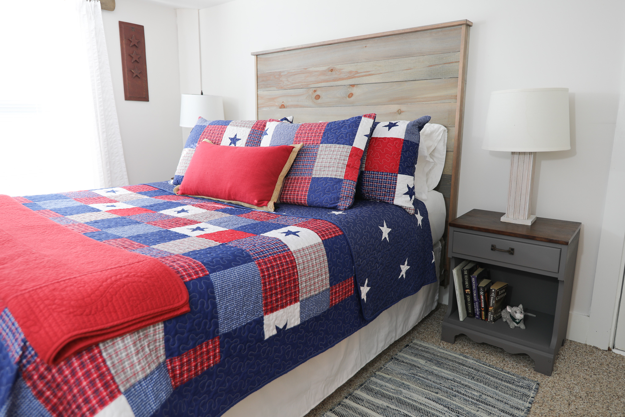 Try a stained top painted base furniture makeover on outdated furniture like this pair of nightstands. A two toned makeover gave them a contemporary and coordinated look in this rustic bedroom.