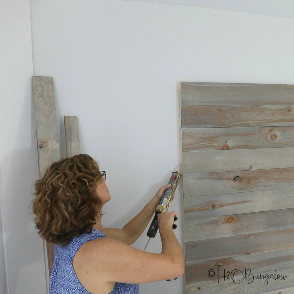 DIY rustic headboard tutorial with video to make a queen size wood headboard. Modify these plans for other bed sizes. Under $50 to make this modern headboard. 