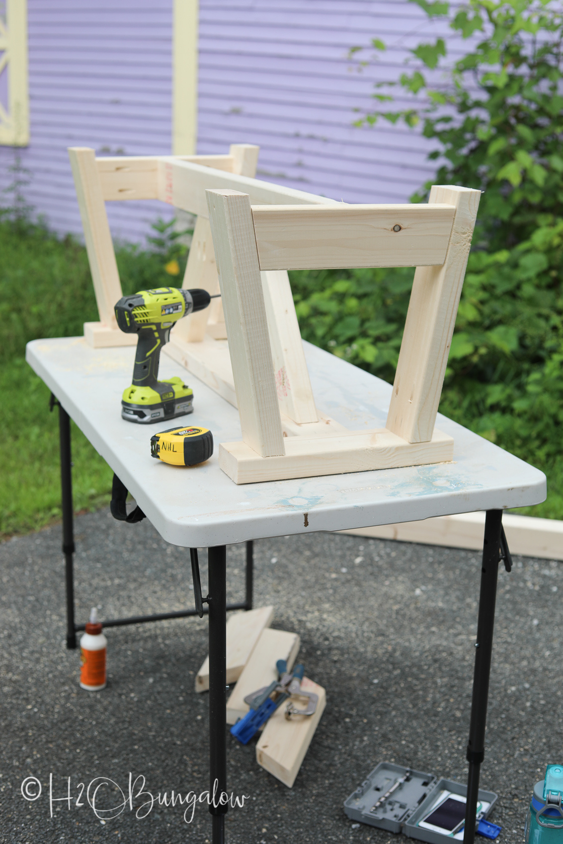 Attaching bench spreaders for a DIY modern rustic wood bench tutorial 