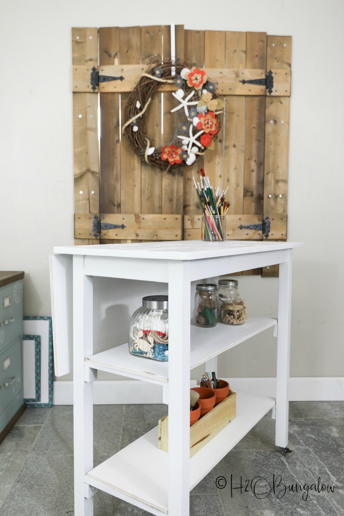 DIY rolling worktable with shelves added 