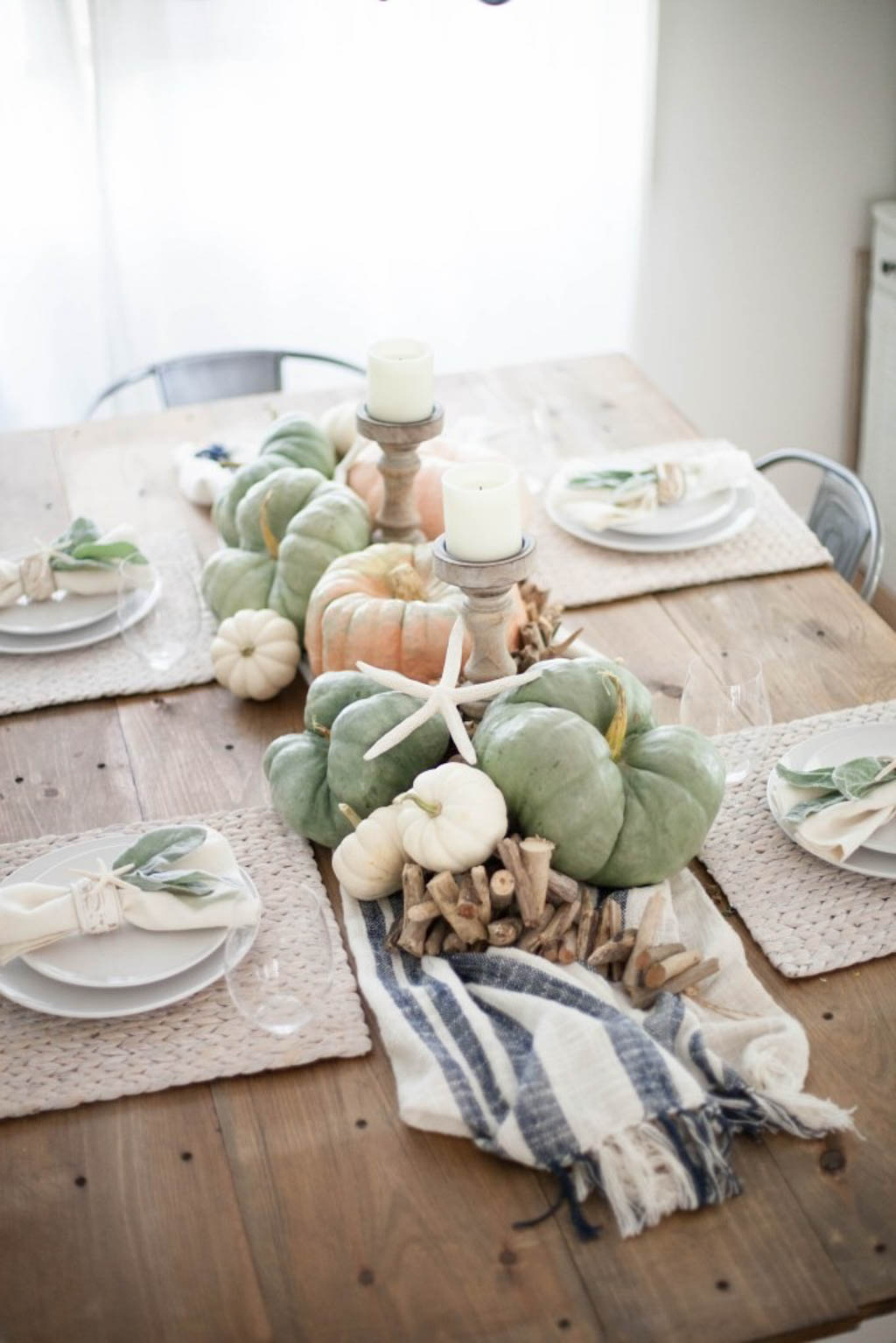 fall tablescape with muted colored pumpkins