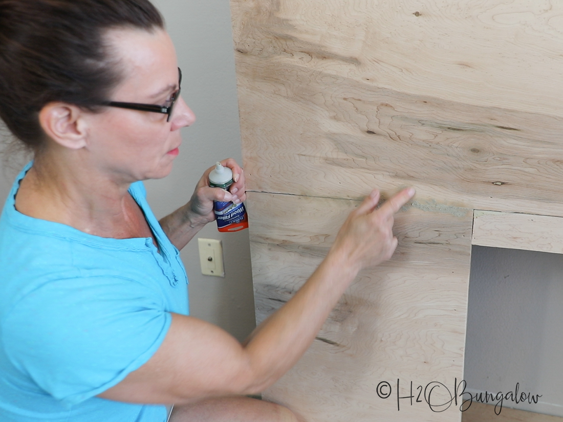 caulking wood frame for DIY fireplace 