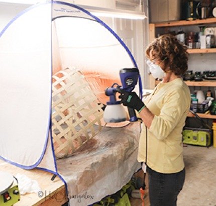 Wendi painting tobacco basket with paint sprayer