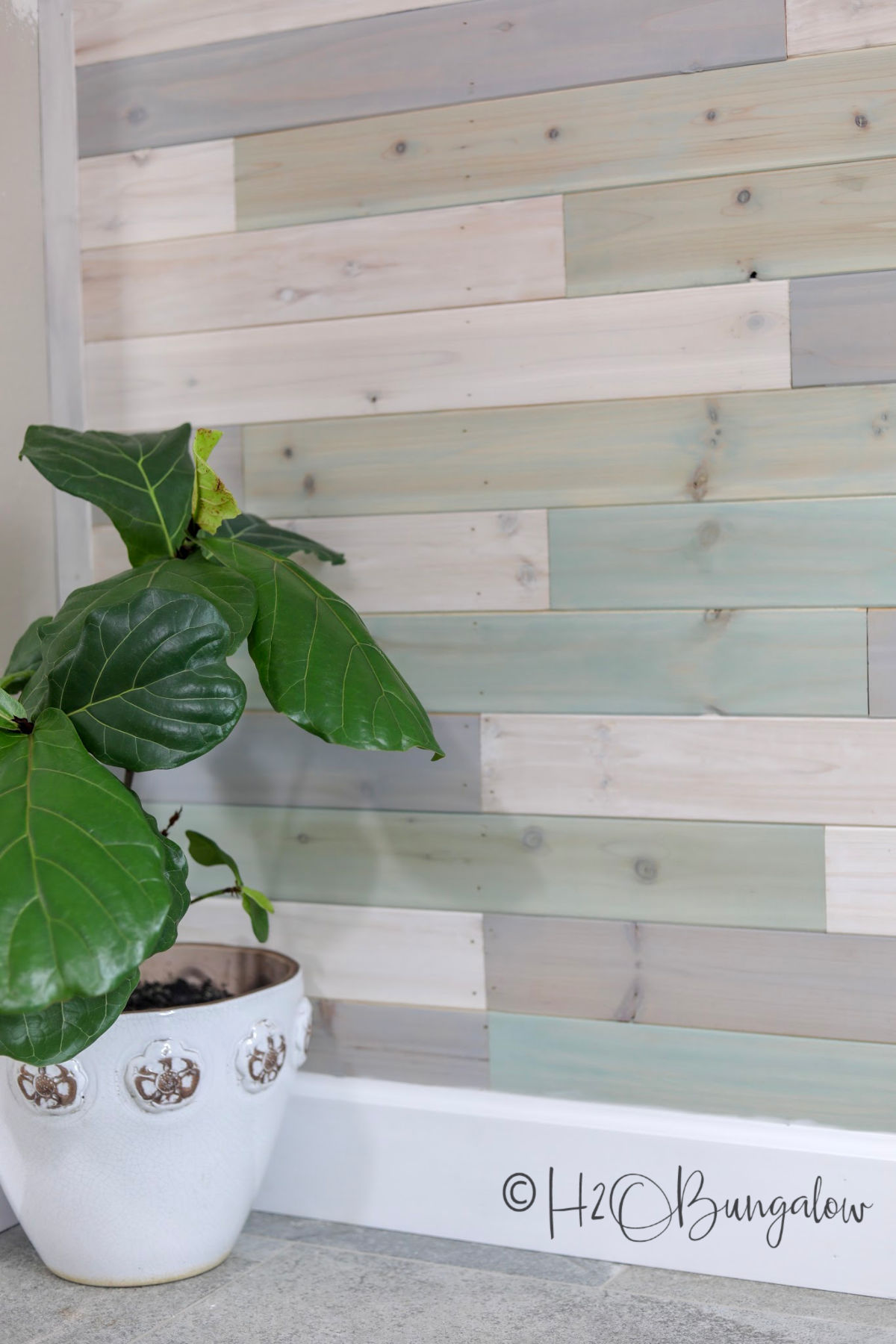 cedar tongue and groove DIY multi colored wood plank wall in a coastal home 