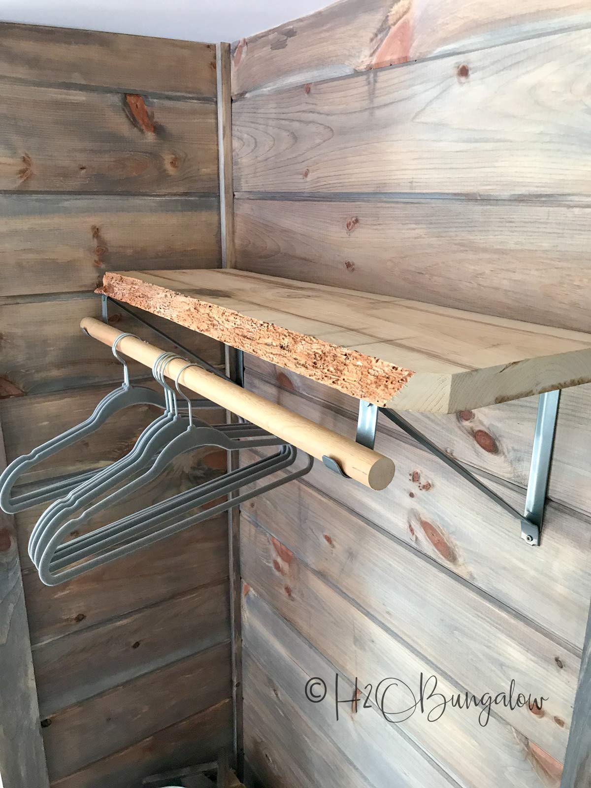 DIY clothes hanging bar with relaimed wood shelf and many more shelf ideas for the home