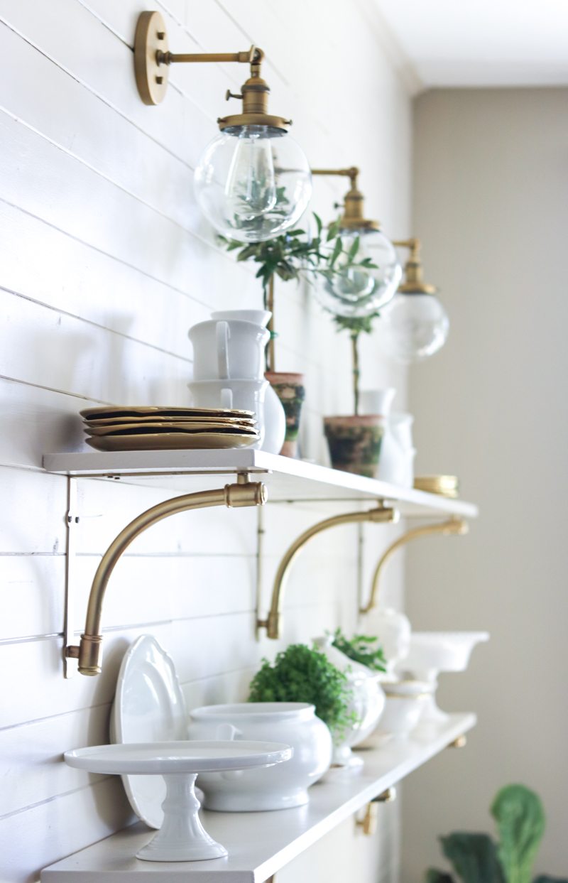 modern gold and white open kitchen shelving 