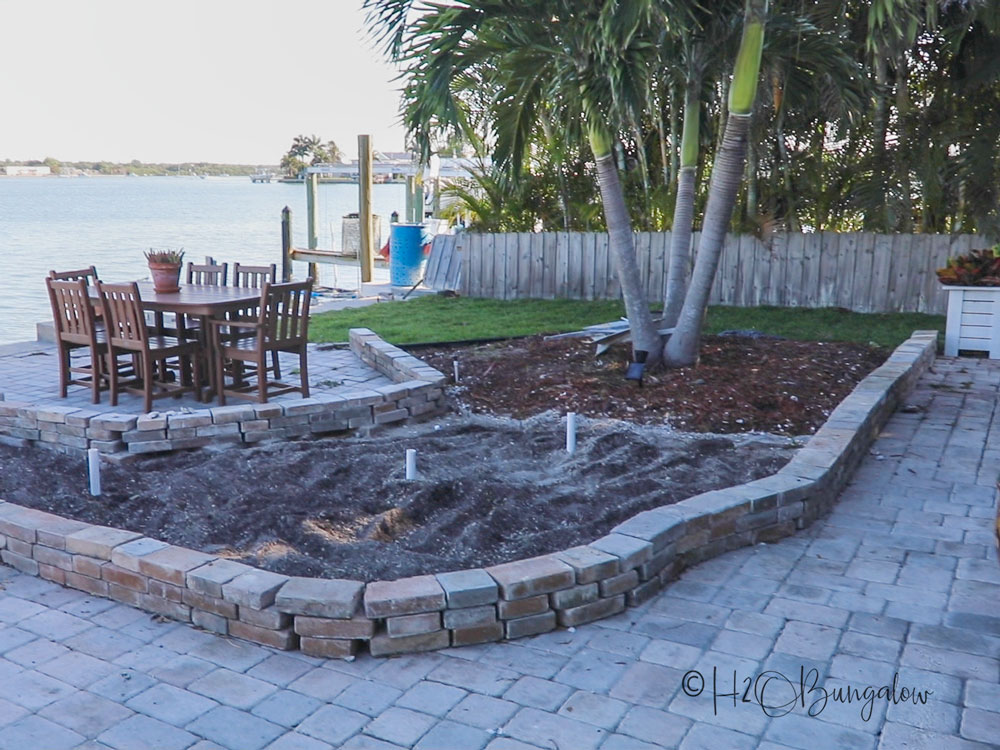 patio garden bed with reusing pavers for garden edging