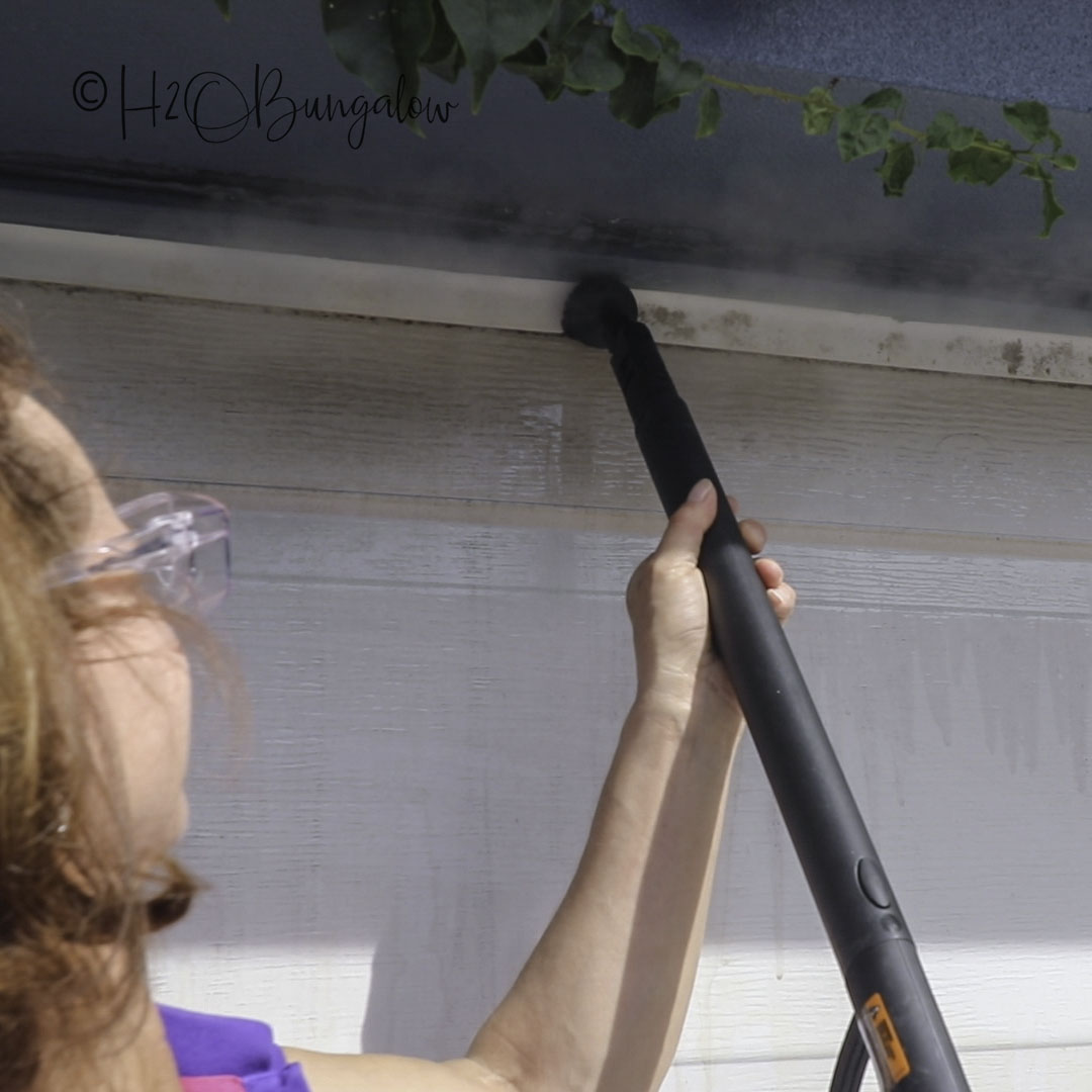 step 1 steam clean to get dirt off garage door