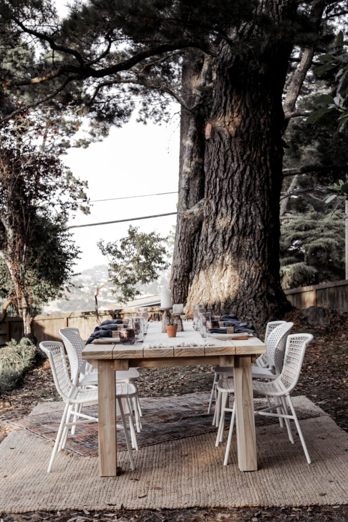 outdoor dining table under a tree 