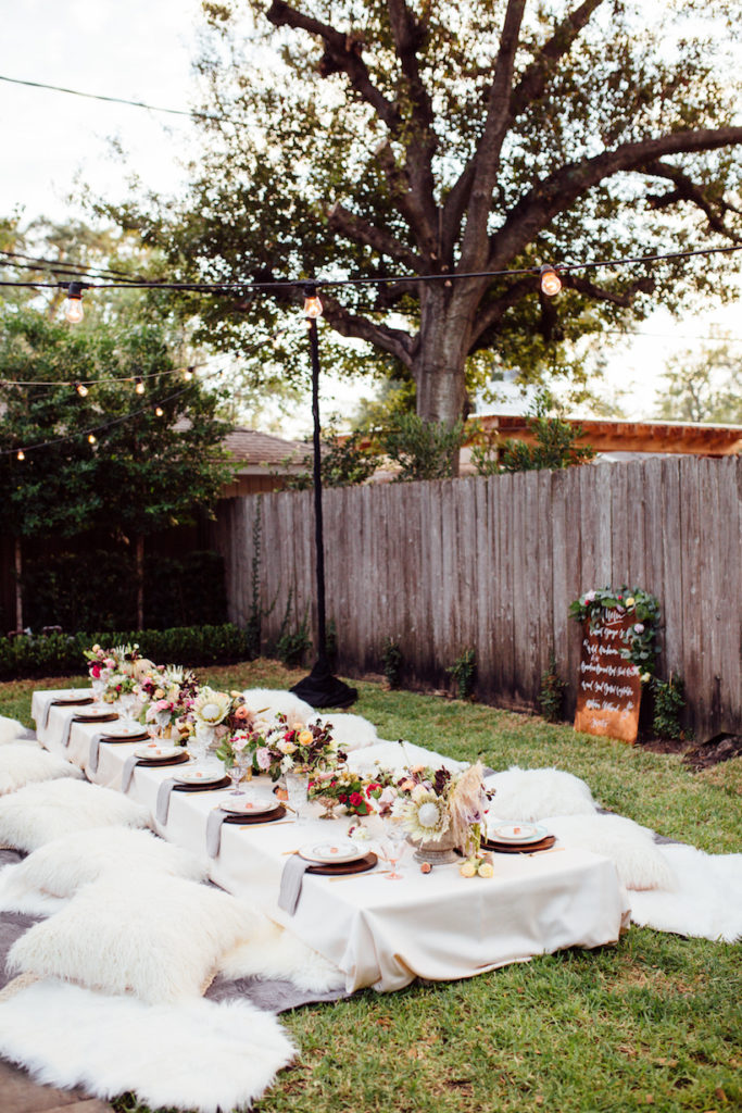 outdoor dining with pillows on ground 