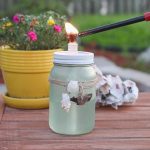 lighting DIY tiki torch with candle lighter