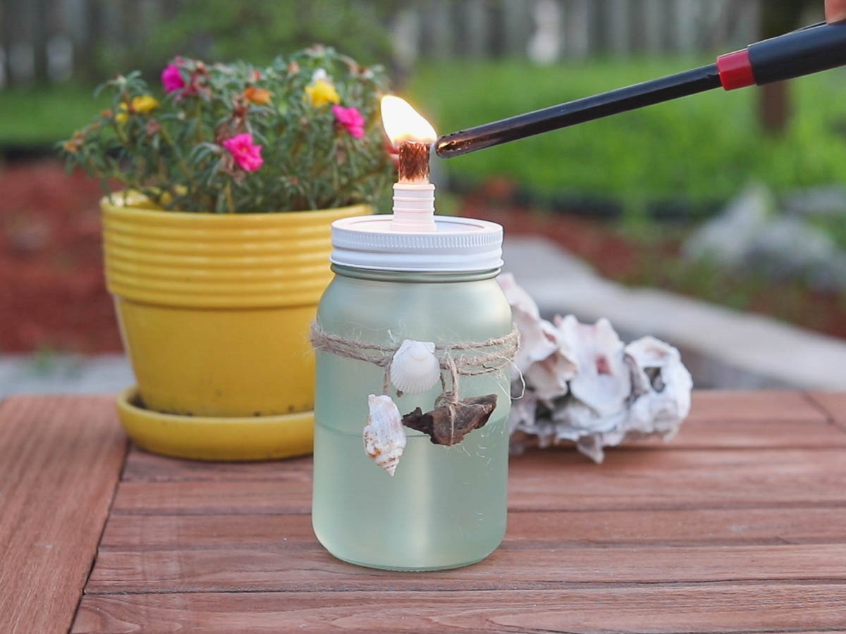 lighting DIY tiki torch with candle lighter