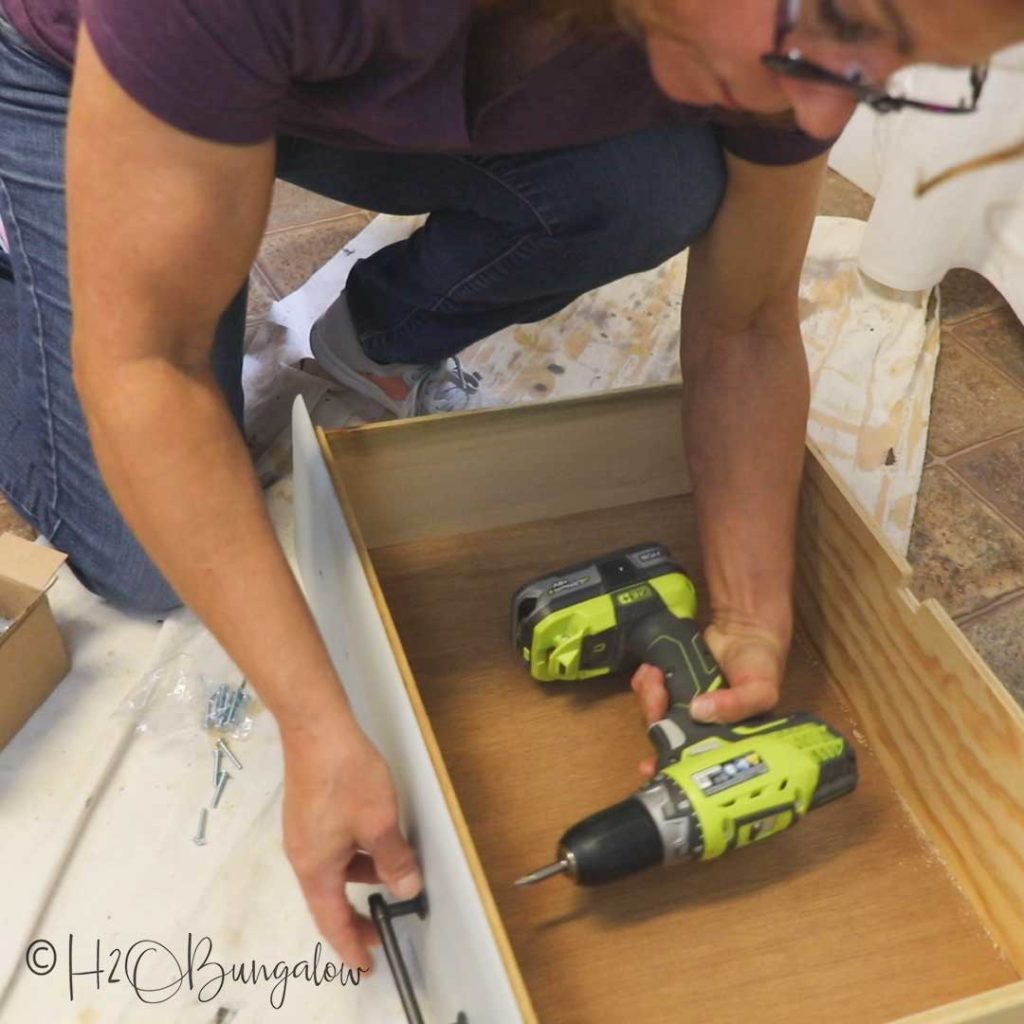 adding drawer pulls back onto dresser 