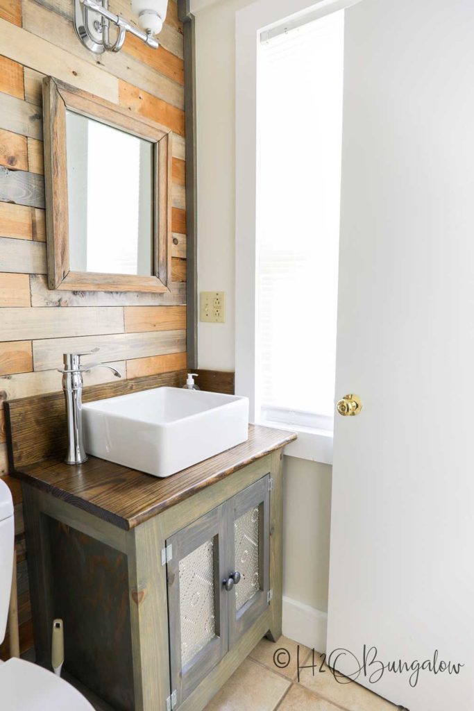 completed pallet wood wall in bathroom 