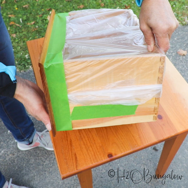 furniture taped to protect surfaces from paint 