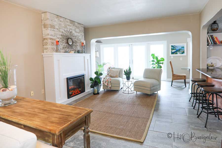 living room with DIY faux stone fireplace and chimney