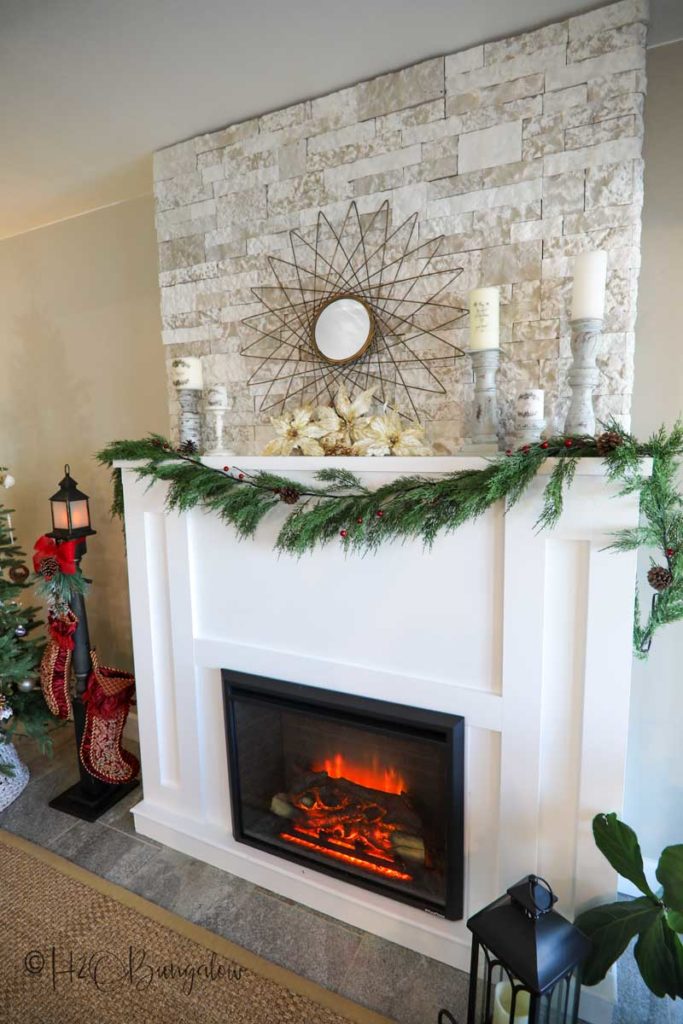 Make this DIY stocking holder stand. A freestanding stocking holder is a great way to hang Christmas stockings you don't have a fireplace mantle to hang them on. #christmasdecor #stockingholder 