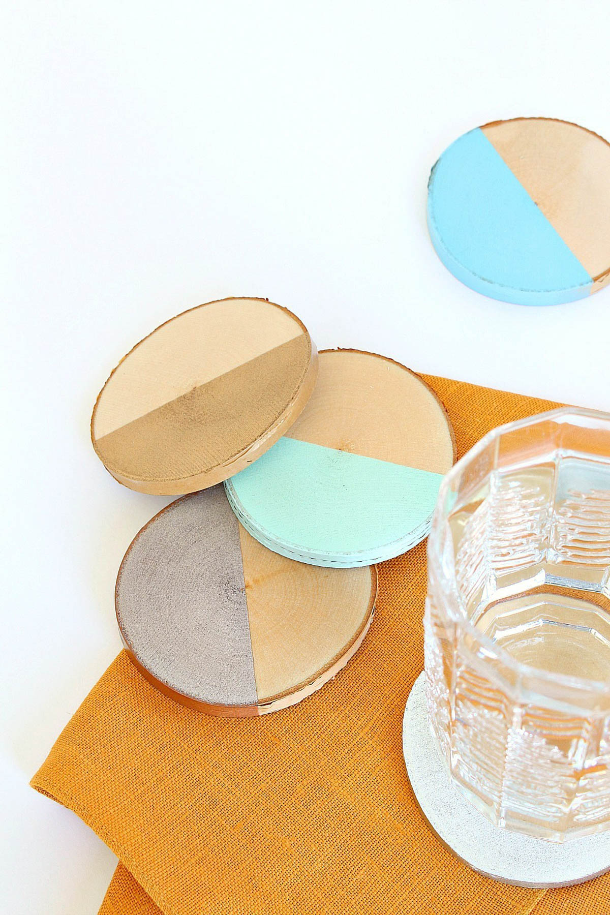 wood slice coasters spray painted for block pattern look