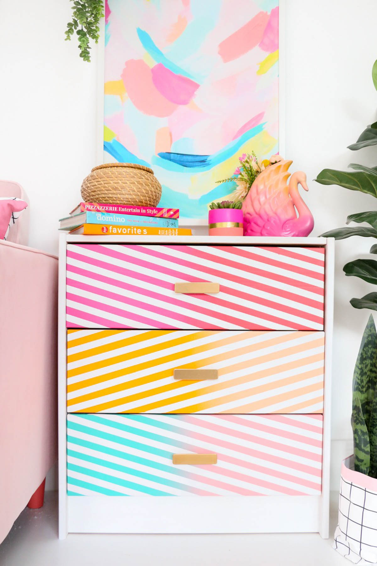 small dresser spray paint project idea with bright colors and stripes