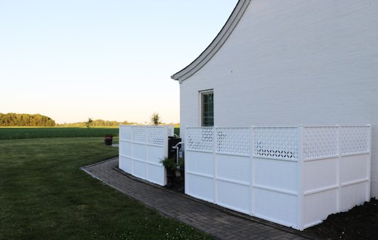 hidden pool pump behind fence 