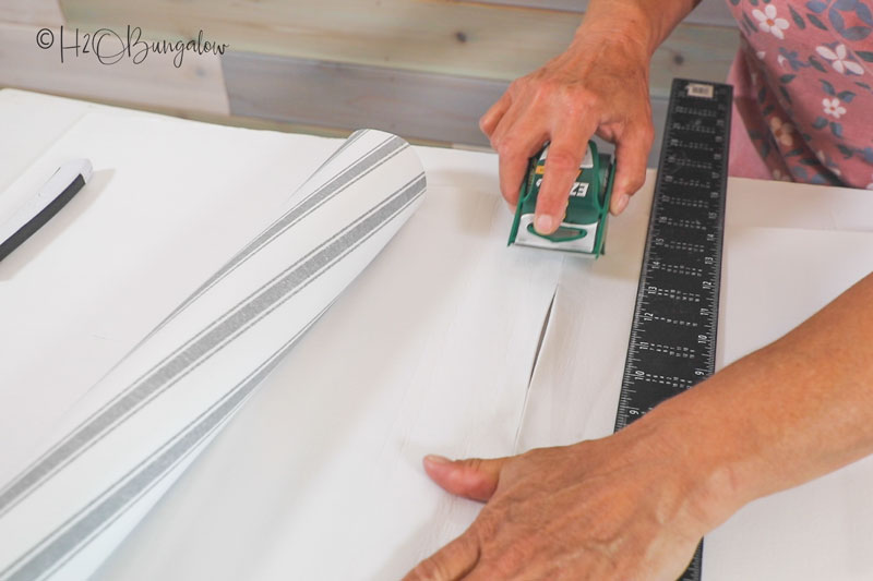 taping two pieces of drawer liner together 