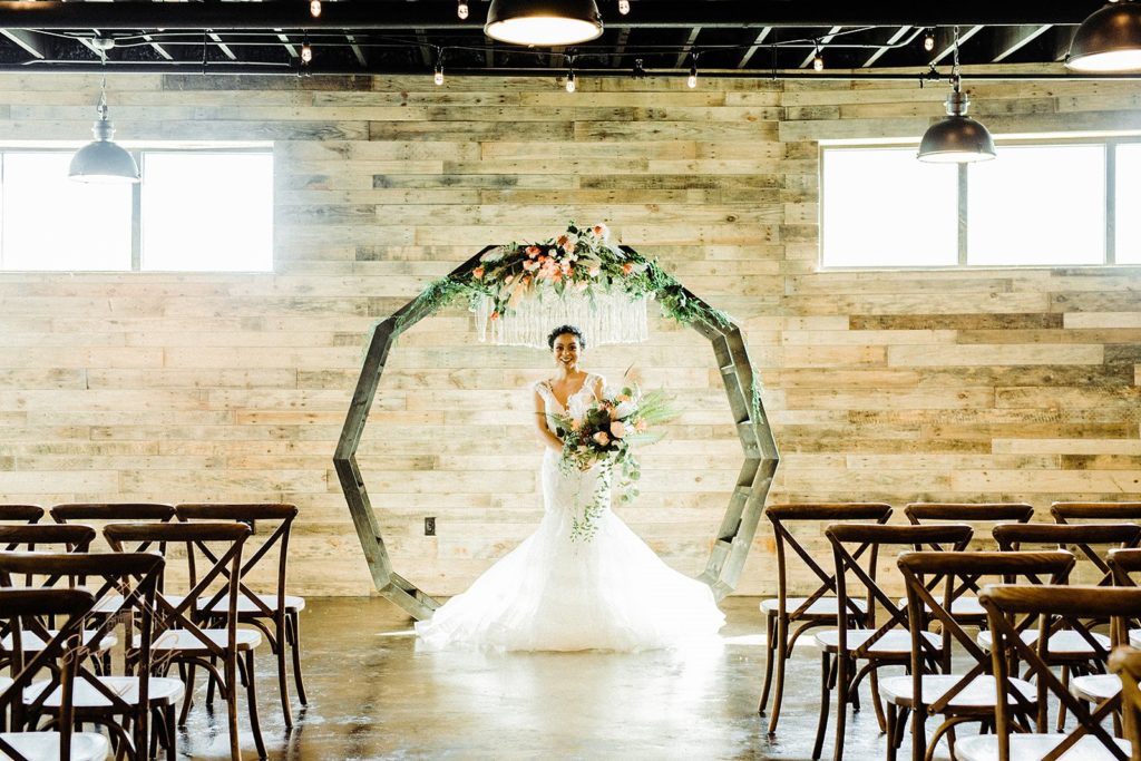 bride with DIY moon gate arch 