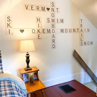 scrabble tile wall art in loft bedroom