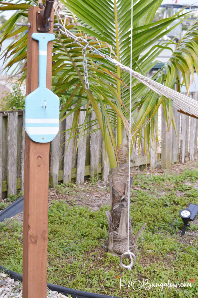 Hook and ring game in the yard next to a palm tree