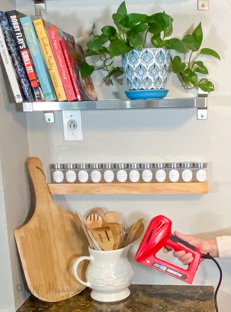 Spice Rack hanging on wall with stapler