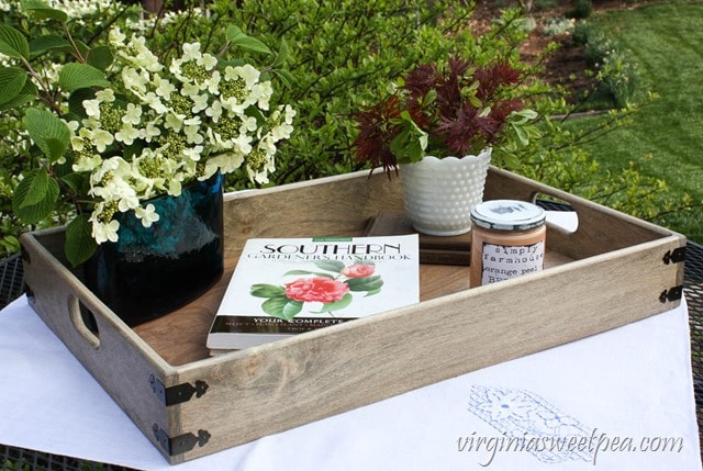 serving tray with flowers and book