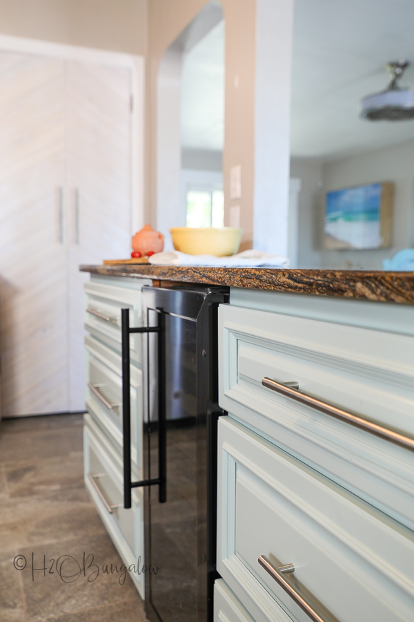 kitchen island base back after makeover with paint and new hardware